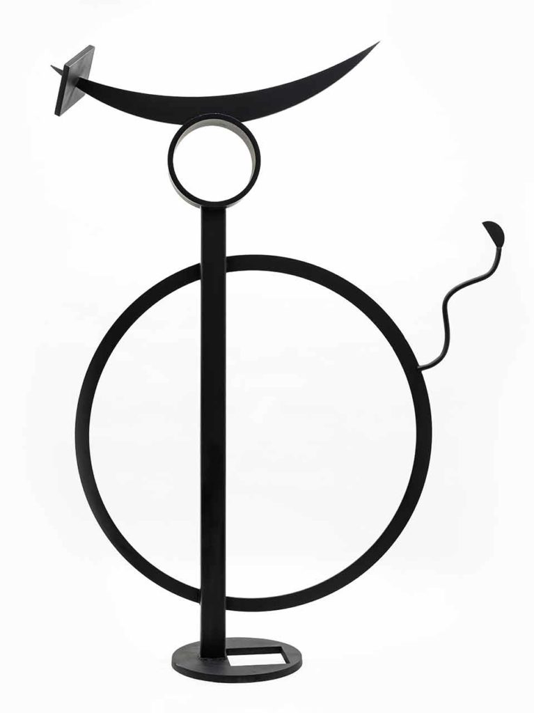 Circular sculpture in black on a white background